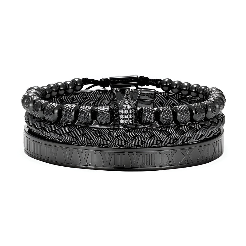 Trio de bracelets homme noirs en acier inoxydable, un tressé, un à billes, un avec détails chiffres romains et couronne.