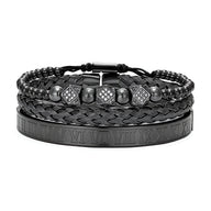 Trio de bracelets noirs en acier inoxydable, tressés et lisses avec chiffres romains gravés et détails carrés décoratifs.