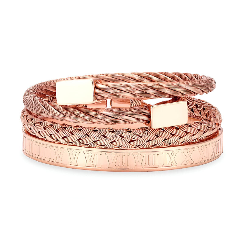 Trio de bracelets en acier inoxydable or rosé, câble torsadé, tresse et manchette gravée de chiffres romains.