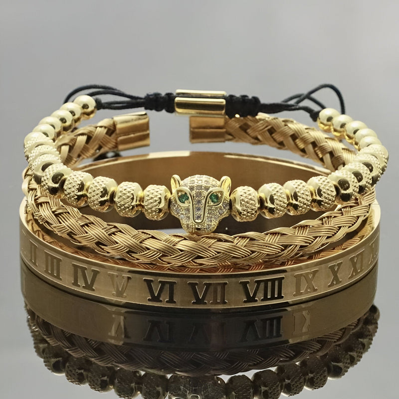 Trio de bracelets homme en acier inoxydable or, motif tête de léopard avec yeux verts, maillons tressés et bracelet lisse.