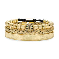 Trio de bracelets en acier inoxydable or avec tête de léopard ornée de détails noirs et verts.