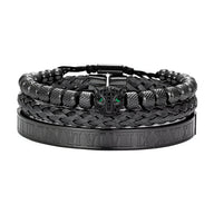 Trio de bracelets noirs en acier inoxydable avec tête de léopard verte et motifs gravés.