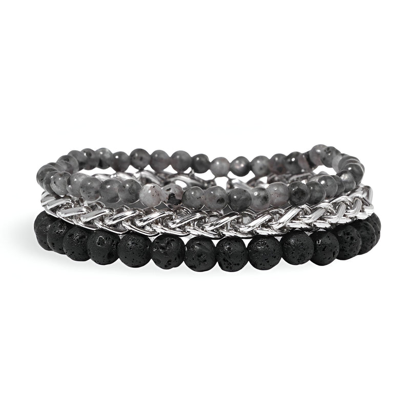 Trio de bracelets pour homme avec pierres naturelles volcaniques noires et perles grises en acier maillé argenté.
