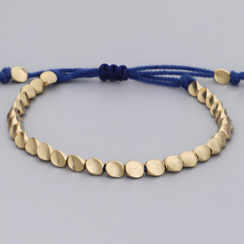 Trio de bracelets tibétains en cuivre doré et corde bleue ajustable pour femme.