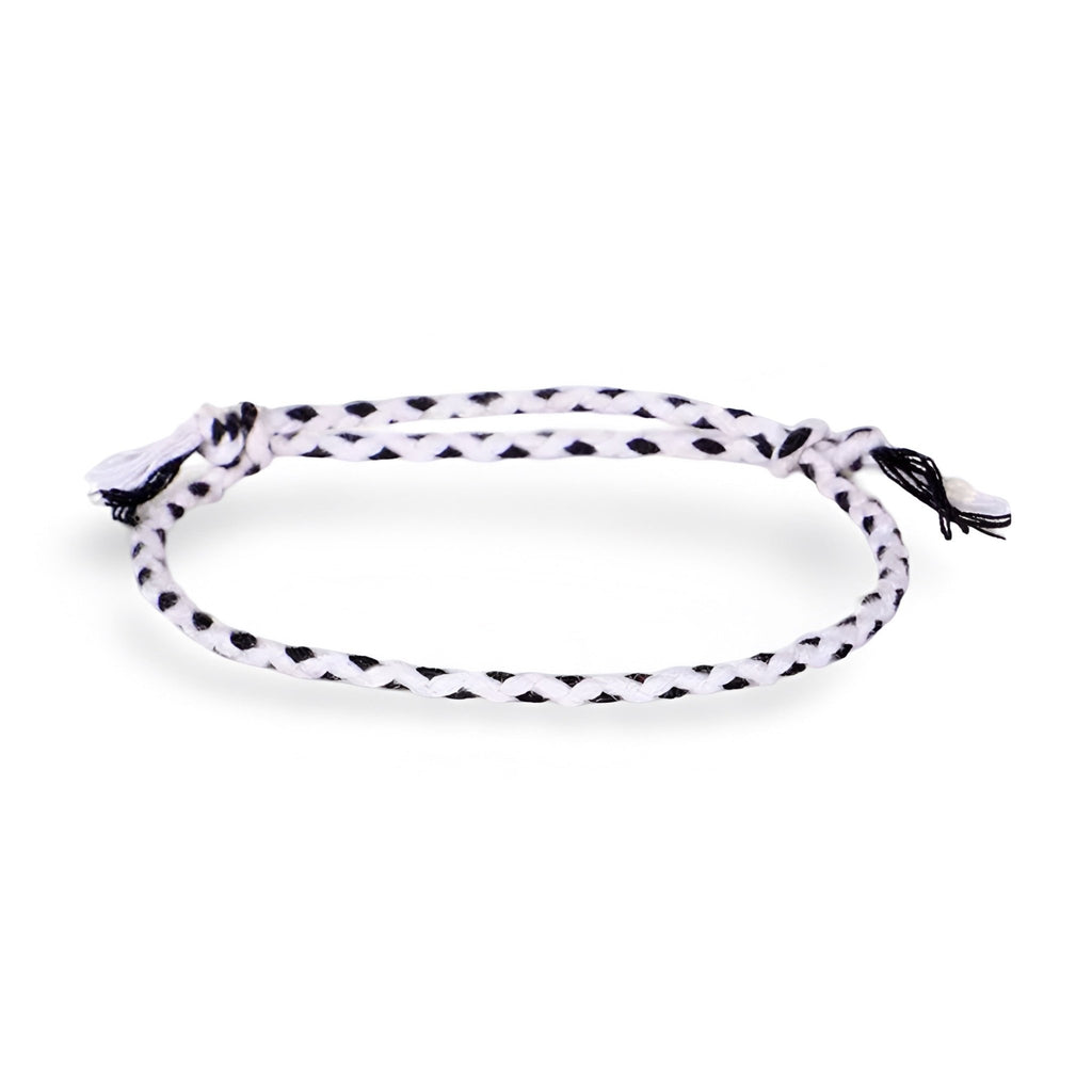 Trio de bracelets tibétains en corde noire et blanche tressée avec nœuds ajustables.