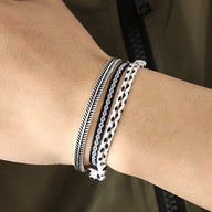 Trio de bracelets tibétains noirs et blancs en coton, corde et cuivre pour homme.