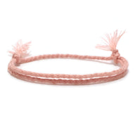 Bracelet tibétain rose en coton tressé avec fermetures à nœud, style minimaliste homme.