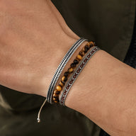 Trio de bracelets homme en cuir, oeil de tigre orange, cuivre et motifs tibétains.