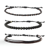 Trio de bracelets tibétains pour homme en pierres noires et fil ciré noir et marron.