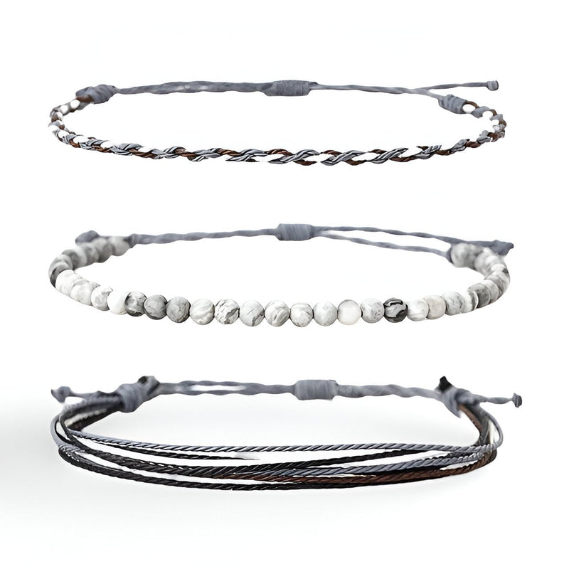 Trio de bracelets tibétains homme, pierres naturelles blanches marbrées et fils cirés gris et marron.