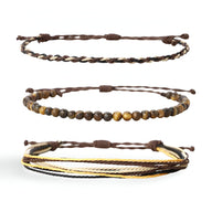 Trio de bracelets tibétains en pierres naturelles œil de tigre et fil ciré marron et jaune, fermoir coulissant.