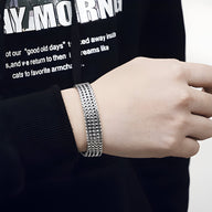 Bracelet homme en acier inoxydable argenté, maillons inspirés de bracelet de montre, finition brillante.