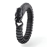 Bracelet noir en acier inoxydable pour homme, design dragon détaillé et finition texturée.