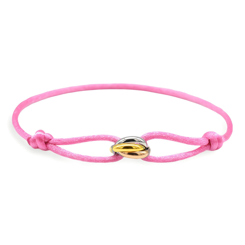 Bracelet cordon rose avec petit pendentif cercles entrelacés en or et argent.