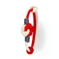 Bracelet cordon bi-colore rouge et beige à nœud central avec détails gris foncé pour homme.