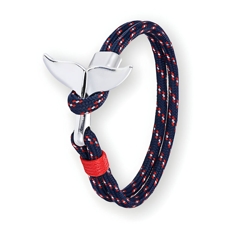 Bracelet cordon bleu marine à motifs rouges, fermoir queue de baleine argenté et couture rouge.