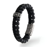 Bracelet homme perles noires acier inoxydable avec motif croix et cuir tressé noir.