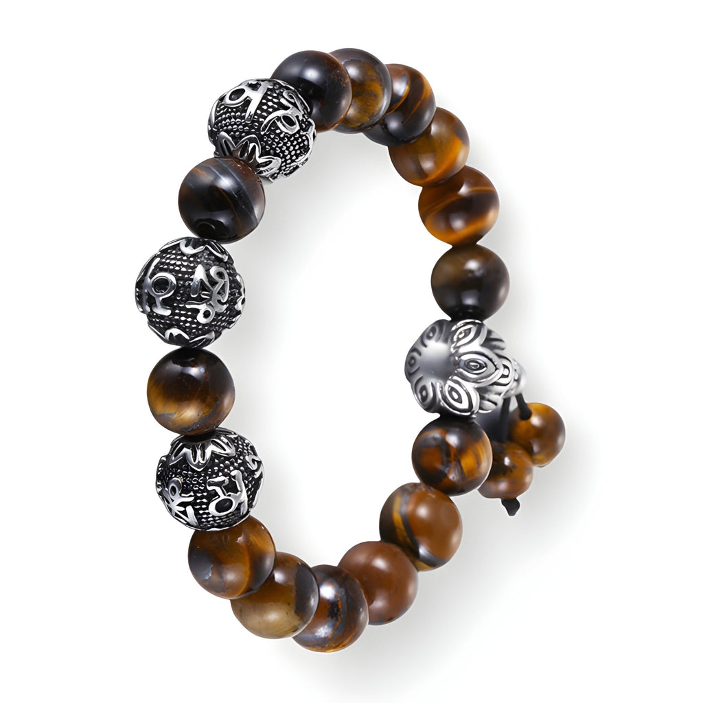 Bracelet homme en perles d’œil de tigre marron avec quatre perles en acier inoxydable gravées et ajourées.