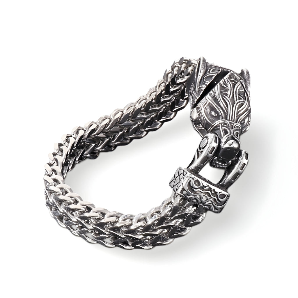 Bracelet en acier inoxydable argenté avec double chaîne tressée et fermoir sculpté tête de loup détaillée.
