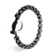 Bracelet pour homme en acier inoxydable noir avec maillons larges et charme en forme d'haltère.