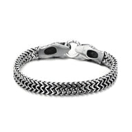 Bracelet en acier inoxydable argenté pour homme avec maillons tressés et double tête de serpent sculptée.