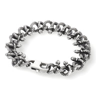 Bracelet homme en acier inoxydable argenté, design entrelacement de serpents, fermeture robuste.