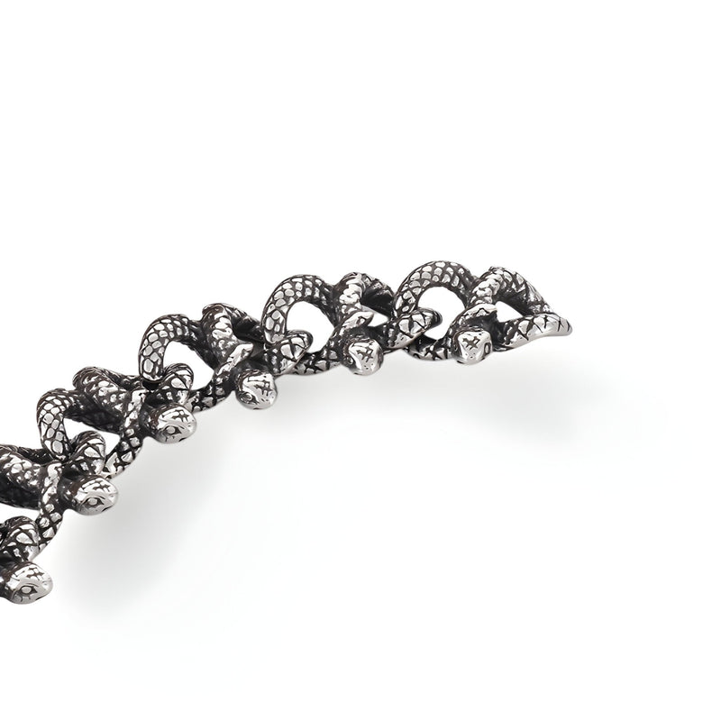 Bracelet argenté en acier inoxydable pour homme avec design entrelacé de serpents détaillé.