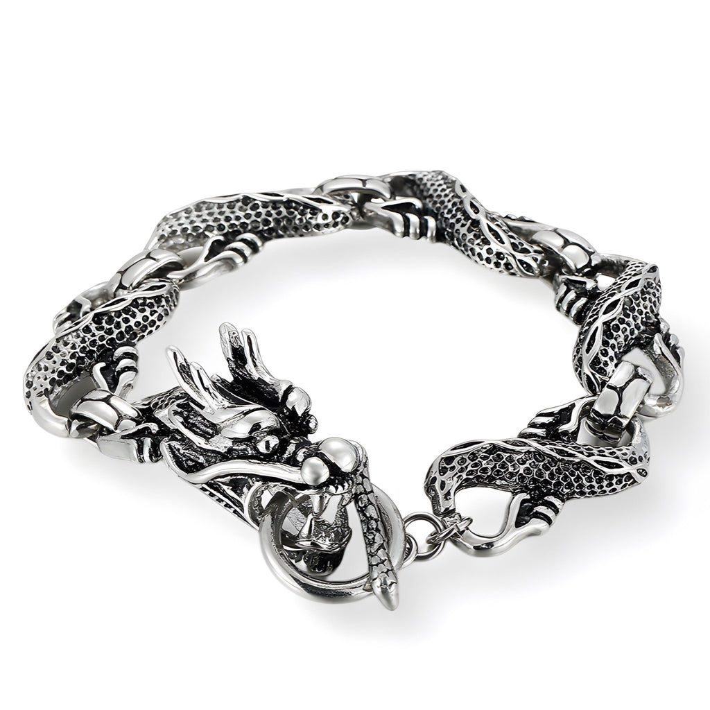 Bracelet homme en acier inoxydable argenté, design dragon avec détails texturés et fermoir anneau élégant.