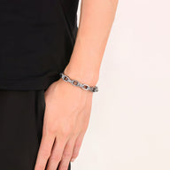 Bracelet homme en acier inoxydable argenté avec motif aigle et maillons larges.