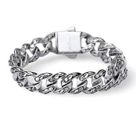 Bracelet en acier inoxydable argenté pour homme avec motif floral gravé sur chaque maille large.