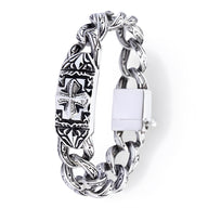 Bracelet homme en acier inoxydable argenté avec motifs celtiques et croix gravés, fermoir solide.