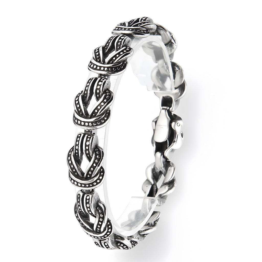 Bracelet homme en acier inoxydable argenté avec motif de nœuds celtiques détaillés et fermeture mousqueton.