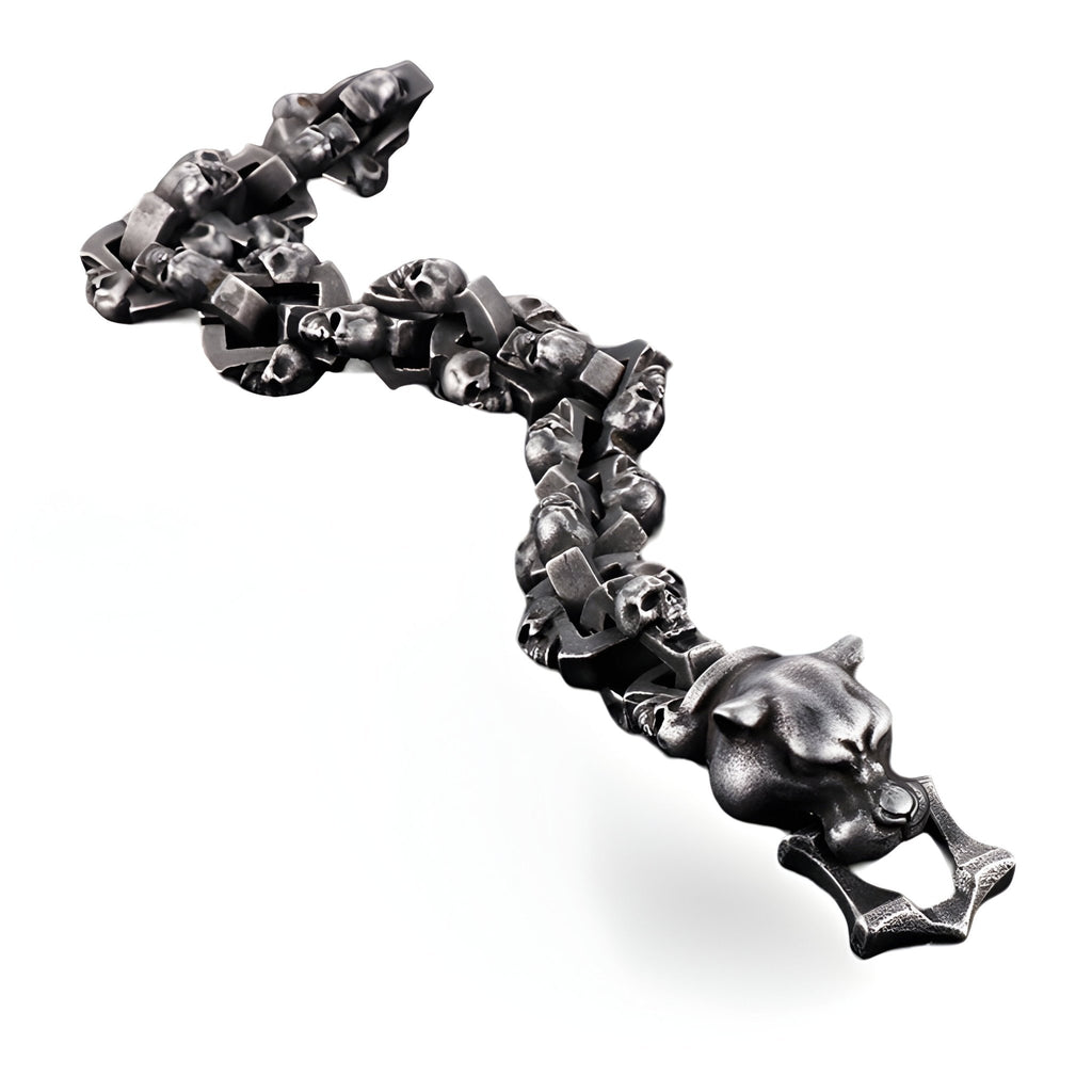 Bracelet homme gris en acier inoxydable avec motifs têtes de mort et tête de chien détaillées.