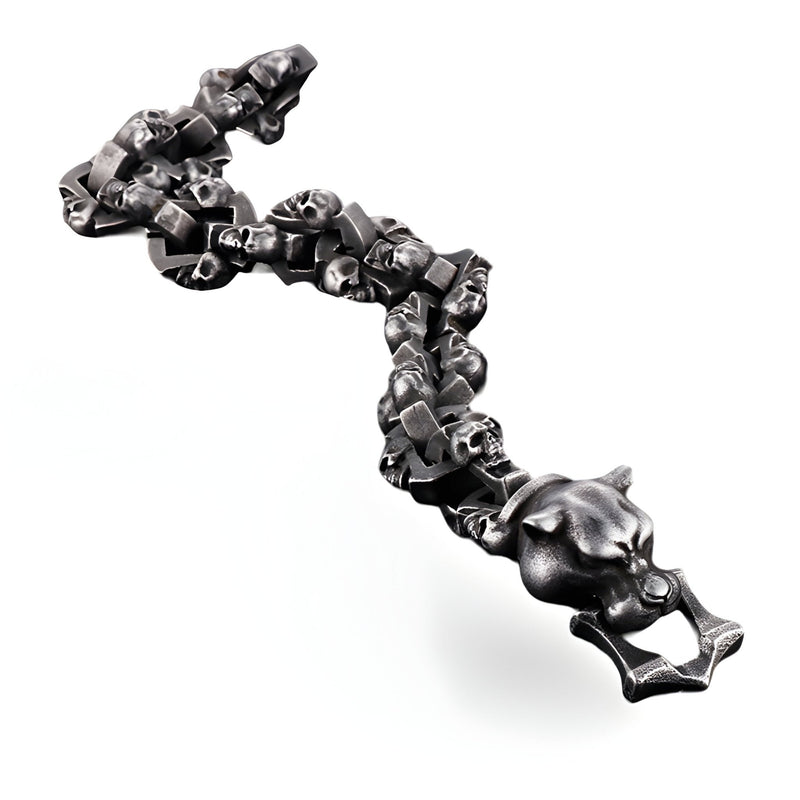 Bracelet homme gris en acier inoxydable avec motifs têtes de mort et tête de chien détaillées.