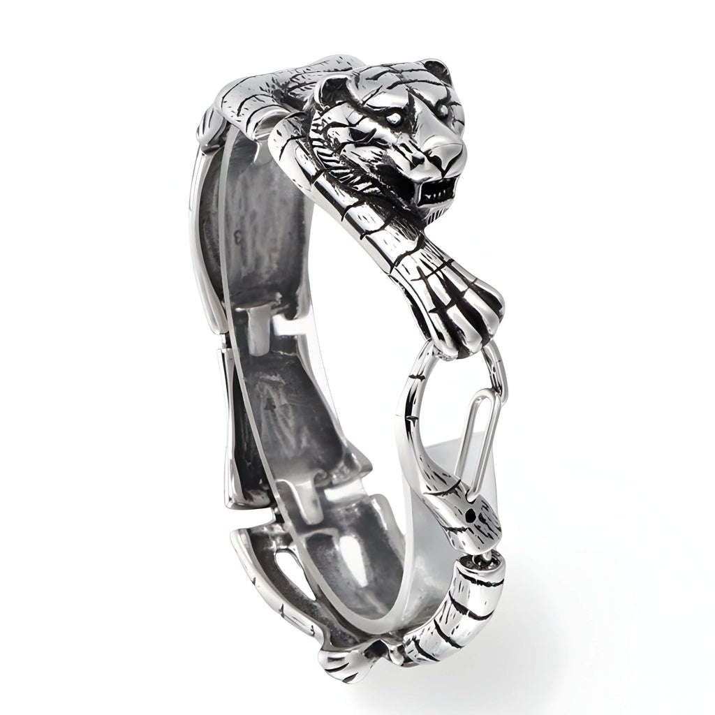 Bracelet homme en acier inoxydable argenté avec tigre sculpté s'accrochant et détail articulé.