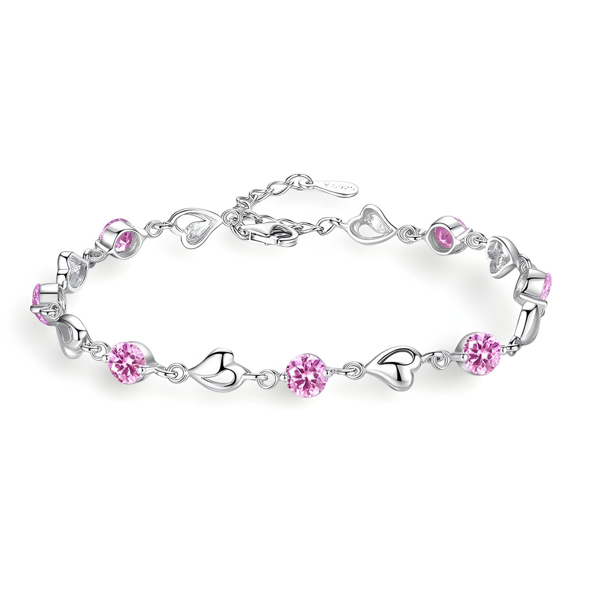 Bracelet en argent avec maillons cœur et pierres roses scintillantes.