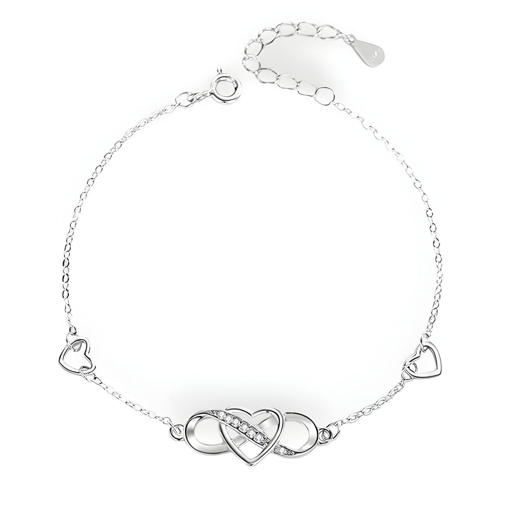 Bracelet en argent sterling avec charm infini et cœur ajouré, deux petits cœurs sur la chaîne.