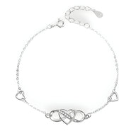 Bracelet en argent sterling avec charm infini et cœur ajouré, deux petits cœurs sur la chaîne.