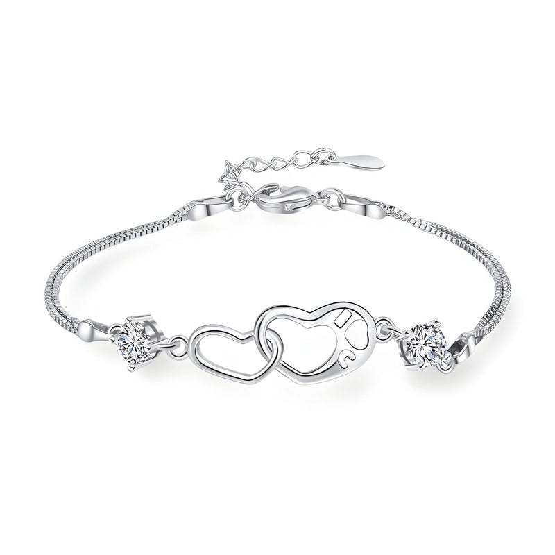 Bracelet argent sterling fin avec cœurs difformes et deux chicots sertis scintillants.