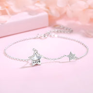 Bracelet fin en argent sterling avec pendentifs étoiles, un petit gravé "Love".