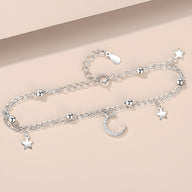 Bracelet en argent sterling avec pendentifs lune et étoiles scintillants, chaîne fine double maillons.