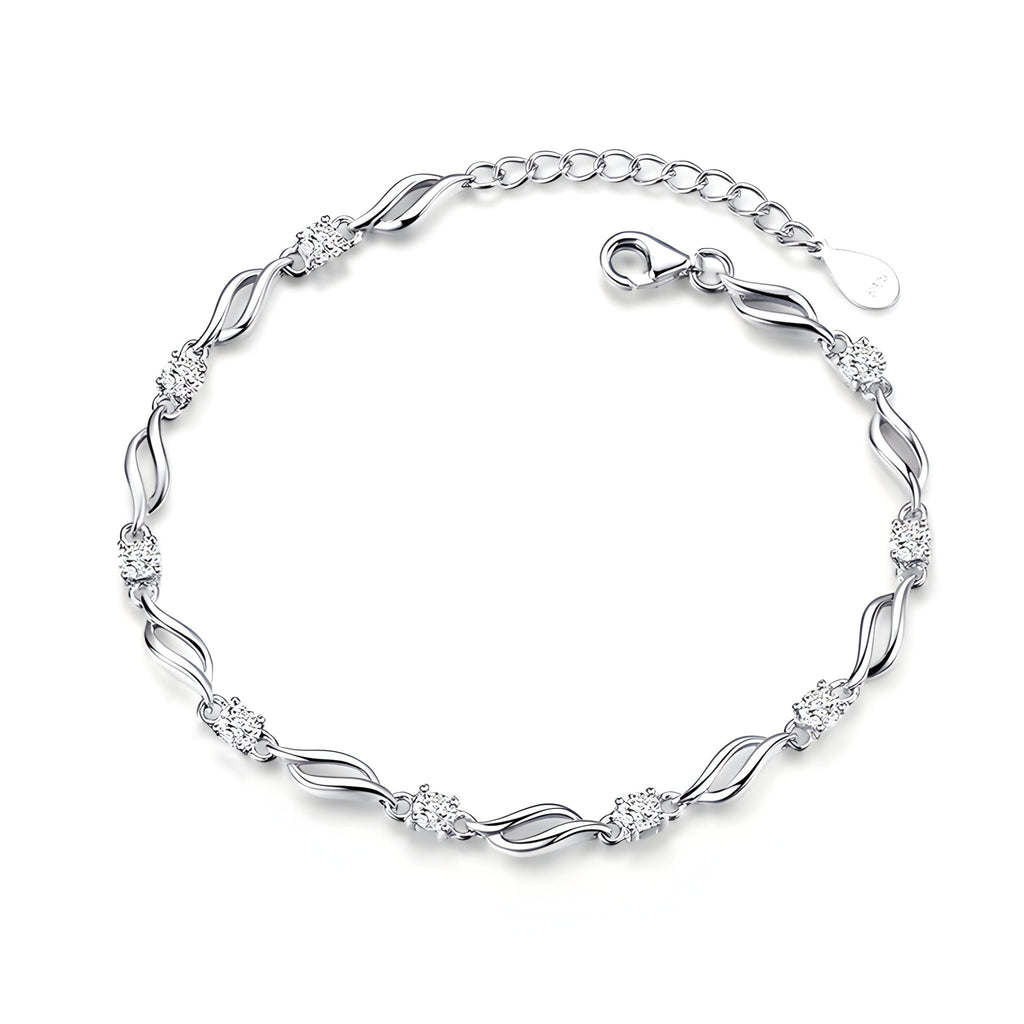 Bracelet femme en argent sterling avec maillons ondulés et détails floraux délicats.