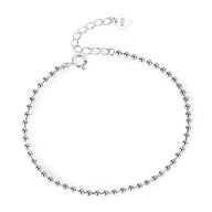 Bracelet fin en argent sterling avec petites perles rondes et fermoir ajustable.