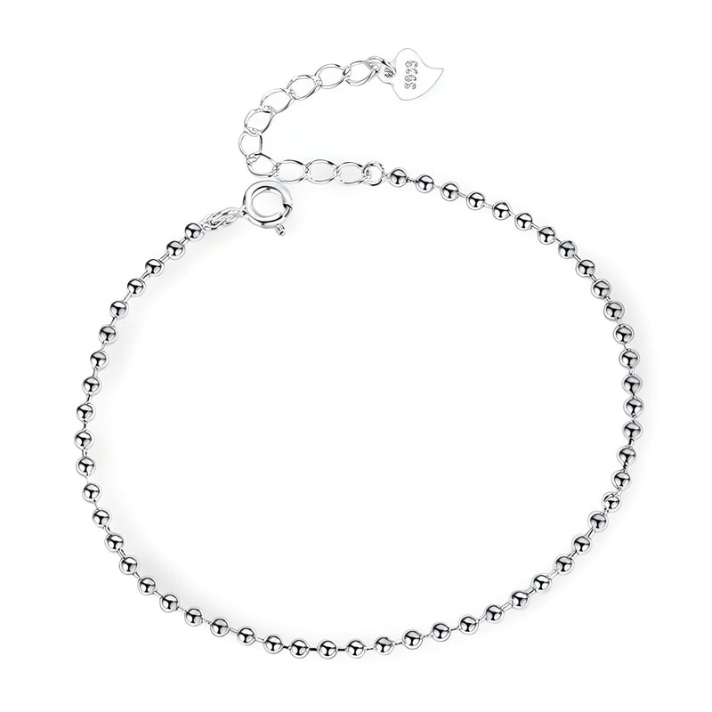 Bracelet fin en argent sterling avec petites perles rondes et fermoir ajustable.