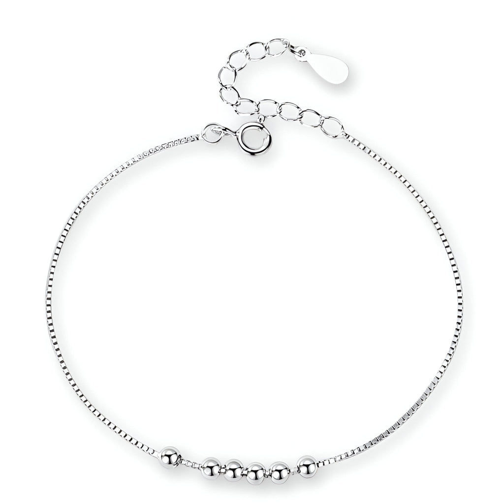 Bracelet fin en argent sterling avec petites perles rondes et chaîne ajustable.