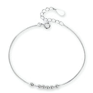 Bracelet fin en argent sterling avec petites perles rondes et chaîne ajustable.