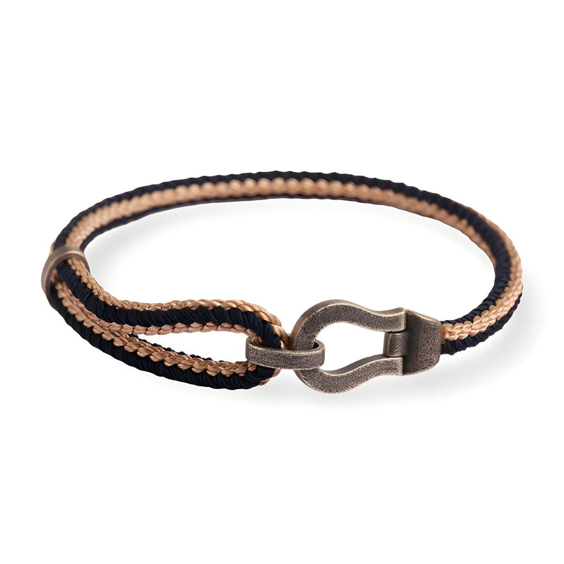Bracelet unisexe en corde noire et beige avec fermoir en forme de fer à cheval en argent sterling.