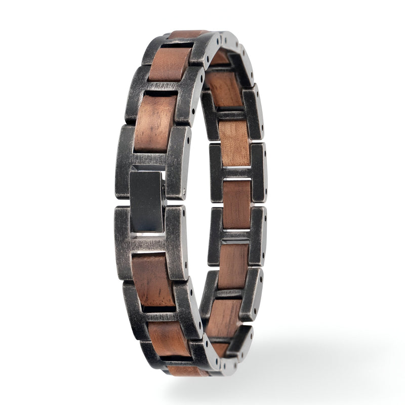 Bracelet homme en bois de noyer marron et acier noir ajouré design moderne et naturel.