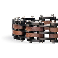 Bracelet homme en bois de noyer noir et marron avec rivets métalliques et design industriel robuste.