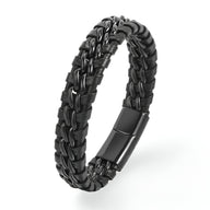 Bracelet en cuir noir tressé avec détails ondulés et fermoir métallique noir mat.